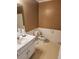 Modest bathroom featuring a single sink vanity with white cabinets and a toilet at 210 Vintage Dr, Covington, GA 30014