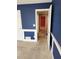 Bedroom with a hall view featuring blue walls with white trim and light-colored carpet at 210 Vintage Dr, Covington, GA 30014