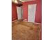 Small bedroom with a closet and red walls at 210 Vintage Dr, Covington, GA 30014