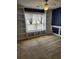 Bedroom with large window, white built-in shelves, and a ceiling fan at 210 Vintage Dr, Covington, GA 30014