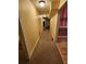 Long hallway with carpet and an overhead light at 210 Vintage Dr, Covington, GA 30014