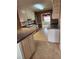 Eat-in kitchen with matching appliances and light colored cabinets with dark countertops at 210 Vintage Dr, Covington, GA 30014