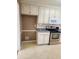 Classic kitchen featuring white cabinets, stainless steel appliances, and neutral countertops at 210 Vintage Dr, Covington, GA 30014