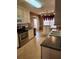 Kitchen featuring white cabinets, stainless steel appliances, an island, and a sink at 210 Vintage Dr, Covington, GA 30014