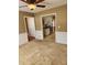 View of living room leading to kitchen with stainless steel appliances at 210 Vintage Dr, Covington, GA 30014