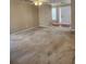 Spacious living room with neutral walls and light-colored carpet and a ceiling fan at 210 Vintage Dr, Covington, GA 30014