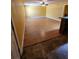 View of the living room showing hardwood floors and a wet bar at 210 Vintage Dr, Covington, GA 30014