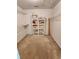 Walk-in closet with shelving units on the walls at 210 Vintage Dr, Covington, GA 30014