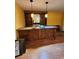 Wet bar featuring granite countertops, a sink and open shelving at 210 Vintage Dr, Covington, GA 30014