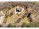 Aerial view of a home showcasing a circular driveway and a large, wooded lot at 4740 Union Hill Rd, Canton, GA 30115