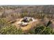 Scenic aerial shot of a charming home set on a sprawling lot with a long private driveway and verdant trees at 4740 Union Hill Rd, Canton, GA 30115