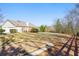 Desirable home featuring a spacious lawn, attached garage, and mature trees at 4740 Union Hill Rd, Canton, GA 30115