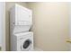 Efficient laundry area with stacked washer and dryer for space-saving convenience at 4740 Union Hill Rd, Canton, GA 30115