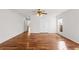 Bright living room showcasing gleaming hardwood floors, a ceiling fan, and ample natural light at 4740 Union Hill Rd, Canton, GA 30115