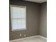 Bedroom with window and gray walls at 1655 Cherry Hill Sw Rd, Conyers, GA 30094