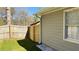 Exterior of house shows back yard with wooden fence and neutral siding at 1655 Cherry Hill Sw Rd, Conyers, GA 30094