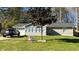 Charming home featuring a well-manicured lawn, light-colored siding, and a newly installed roof at 1655 Cherry Hill Sw Rd, Conyers, GA 30094