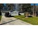 Charming home featuring a well-manicured lawn, light-colored siding, and a newly installed roof at 1655 Cherry Hill Sw Rd, Conyers, GA 30094