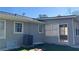 Exterior view of the house with blue siding, windows, AC unit, and sunroom access at 1655 Cherry Hill Sw Rd, Conyers, GA 30094