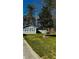 Charming home featuring a well-manicured lawn, light-colored siding, and a newly installed roof at 1655 Cherry Hill Sw Rd, Conyers, GA 30094