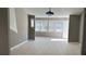 Bright living room with neutral walls and vinyl flooring at 1655 Cherry Hill Sw Rd, Conyers, GA 30094