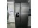 Stainless steel side-by-side refrigerator with water and ice dispenser at 1655 Cherry Hill Sw Rd, Conyers, GA 30094
