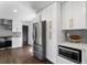 Modern kitchen with stainless steel appliances, quartz countertops, and white cabinetry at 1970 Furlong Run, Lawrenceville, GA 30043