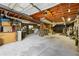 Spacious unfinished basement with exposed wood ceiling beams offers ample storage and customization opportunities at 2415 Wales Dr, Austell, GA 30106