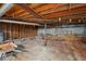 Unfinished basement featuring exposed beams and utilities offers potential for future expansion or customization at 2415 Wales Dr, Austell, GA 30106