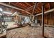 Unfinished basement shows exposed beams and utilities, with potential for future renovation or storage at 2415 Wales Dr, Austell, GA 30106