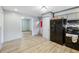 This kitchen offers black appliances, and wood-look flooring at 2415 Wales Dr, Austell, GA 30106