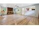 Open living space featuring a cozy fireplace and hardwood floors, perfect for entertaining at 2415 Wales Dr, Austell, GA 30106