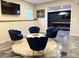 Basement seating area with unique polished concrete floors, and view into recreation area at 410 Spring Lake Hls, Canton, GA 30114