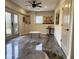 Finished basement with stylish floors, natural light, and casual seating near the door to the outside at 410 Spring Lake Hls, Canton, GA 30114