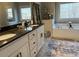 Bathroom with dual sinks, dark granite countertops and garden tub at 410 Spring Lake Hls, Canton, GA 30114