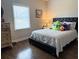 Bedroom with hardwood floors, natural light and black leather headboard at 410 Spring Lake Hls, Canton, GA 30114