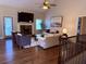 Spacious living room with wood floors, fireplace, large television, and vaulted ceiling at 410 Spring Lake Hls, Canton, GA 30114