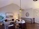Cozy living room with vaulted ceiling, ceiling fan, hardwood floors, and a staircase at 410 Spring Lake Hls, Canton, GA 30114