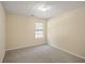 Neutral bedroom features plush carpeting, a window for natural light, and fresh paint at 63 Shadowhill Ct, Loganville, GA 30052