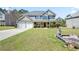 Charming two-story home featuring a well-manicured lawn and a two-car garage at 63 Shadowhill Ct, Loganville, GA 30052