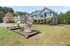 View of a house with a well-kept lawn and attractive landscaping features at 63 Shadowhill Ct, Loganville, GA 30052
