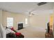 Spacious living area with fireplace, windows, and a view of the second floor at 63 Shadowhill Ct, Loganville, GA 30052