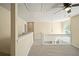 Upstairs loft area featuring natural light and neutral colored walls and carpeting at 63 Shadowhill Ct, Loganville, GA 30052