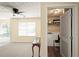 Spacious upstairs loft area featuring a ceiling fan and view of the laundry room at 63 Shadowhill Ct, Loganville, GA 30052