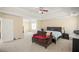 Spacious primary bedroom with a ceiling fan and sitting area at 63 Shadowhill Ct, Loganville, GA 30052