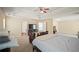 Large main bedroom with tray ceilings, ceiling fan, and ample natural light at 63 Shadowhill Ct, Loganville, GA 30052