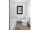 Bright bathroom with new floors, paint, and a tub at 1463 Rockmoor Ct, Stone Mountain, GA 30088