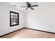 Inviting bedroom with natural light, wood-look flooring, and a ceiling fan at 1463 Rockmoor Ct, Stone Mountain, GA 30088