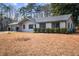Single-story home with an attached garage and front yard bushes at 1463 Rockmoor Ct, Stone Mountain, GA 30088