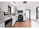 This renovated kitchen features stainless appliances, updated cabinetry, and modern countertops at 1463 Rockmoor Ct, Stone Mountain, GA 30088